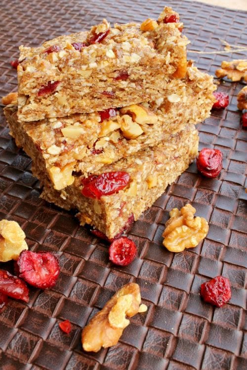 No-Bake Orange Cranberry Snack Bars - Great for on-the-go snacking to give your kids energy. They'll enjoy helping to make them too! Found at The Happy Housewife
