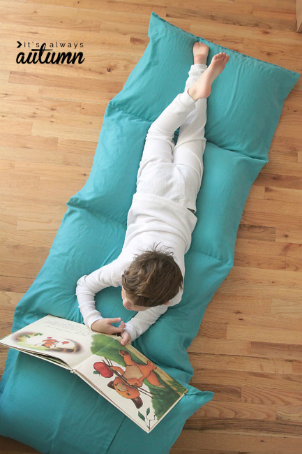 Use it as a bed, fold it up and use it as a chair, or turn it into a fort. This kid's pillow bed is sure to be a big hit with any kid on your list.  100 Days of Homemade Christmas Gifts at The Happy Housewife
